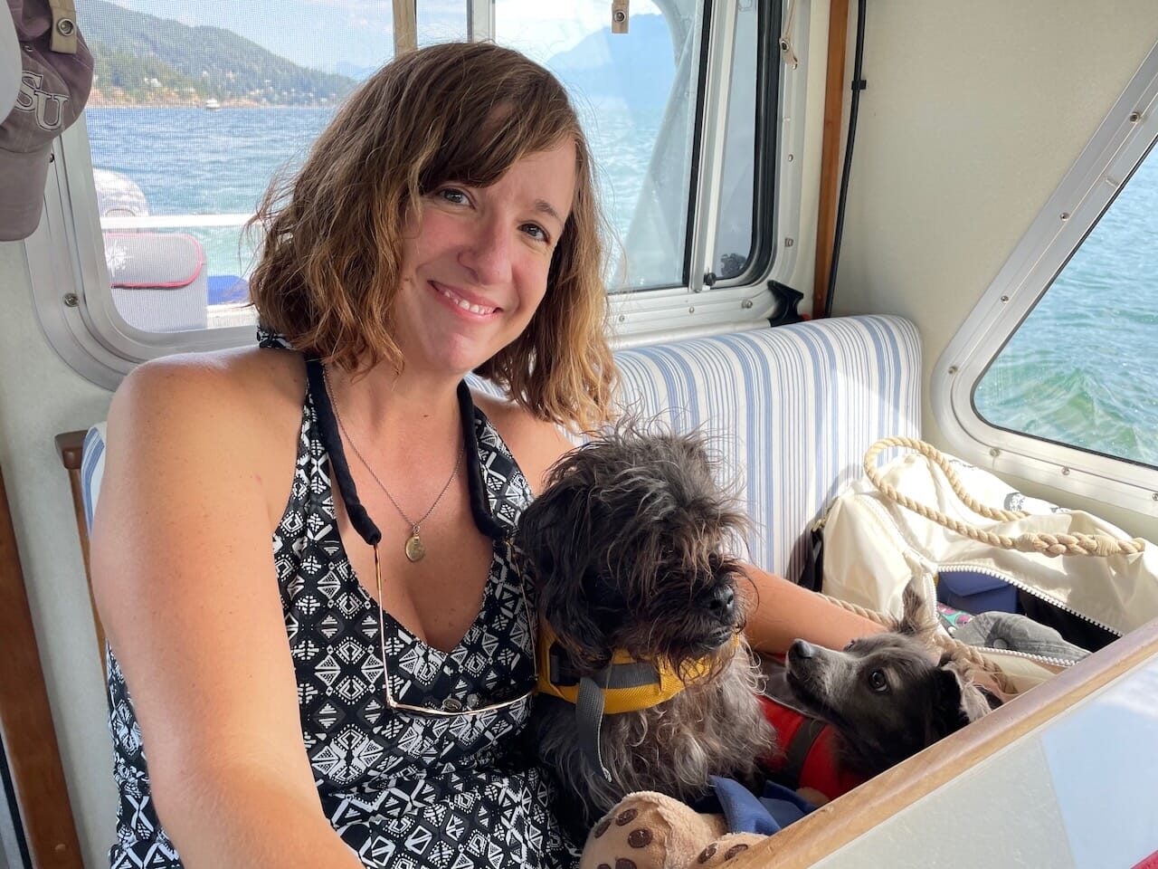 Katie with friends Luther and Winston boating in British Columbia.