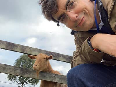 John with a curious goat